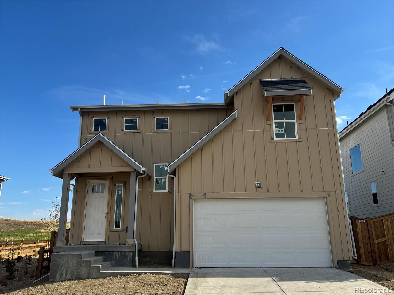 a front view of a house with parking space