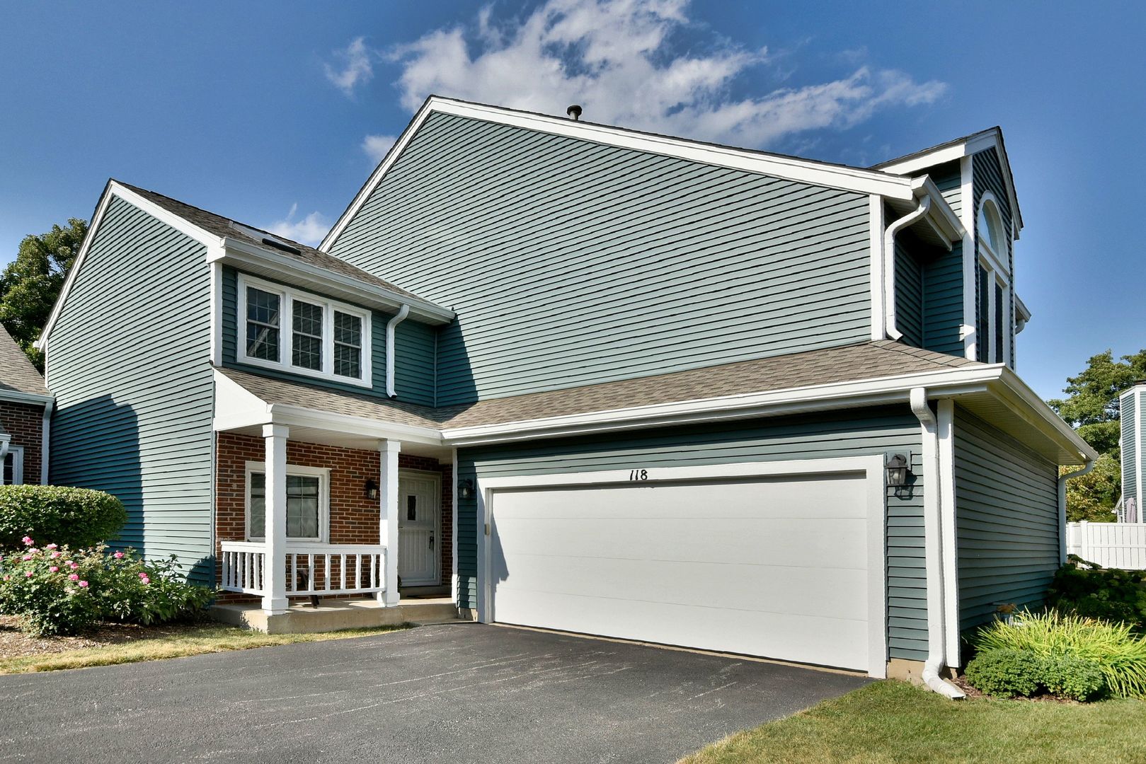 a front view of a house with a garage