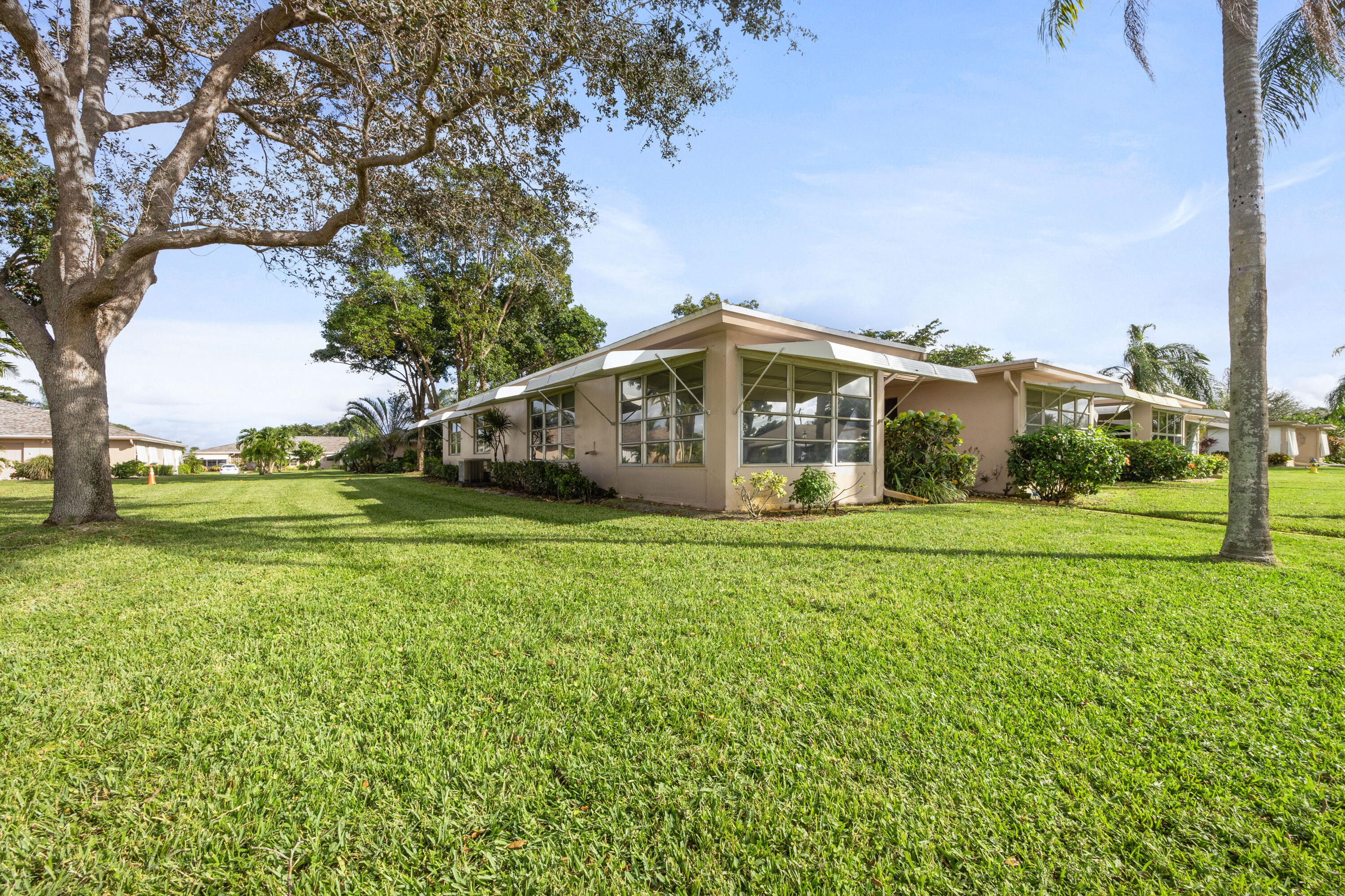 a view of a house with a big yard