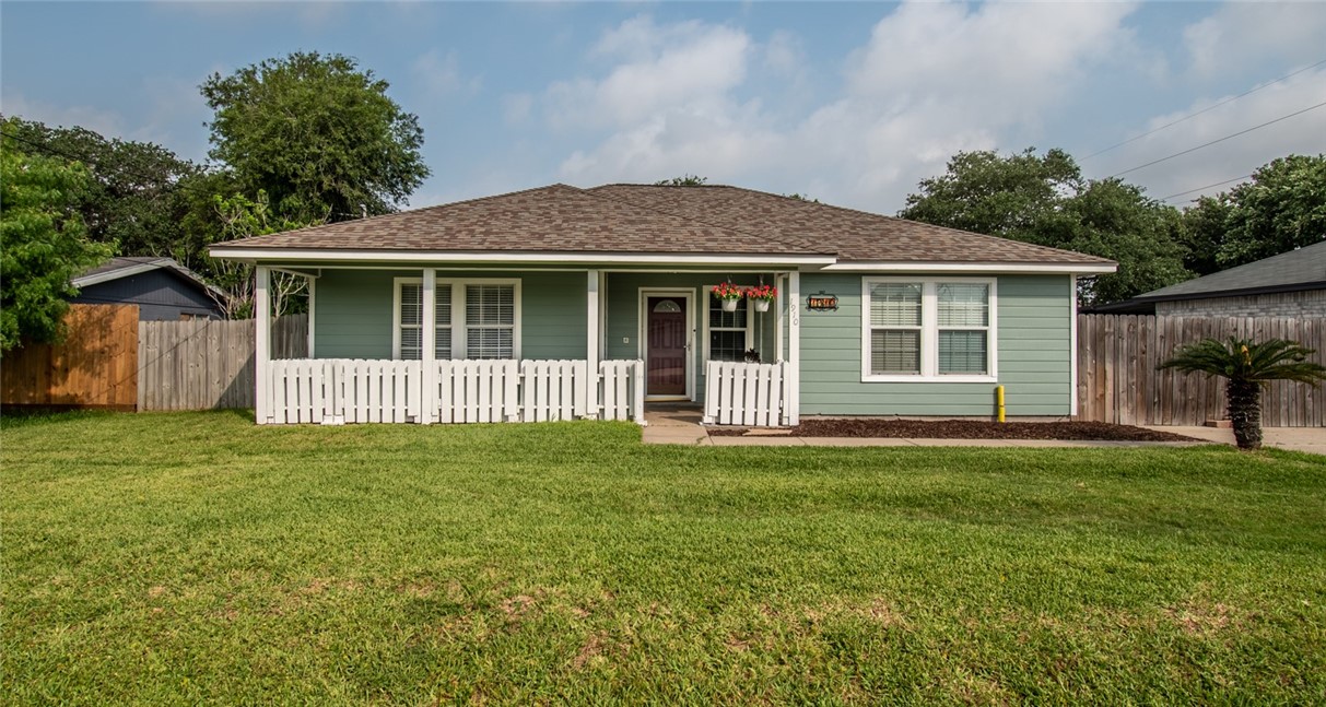 a view of a house that has a garden