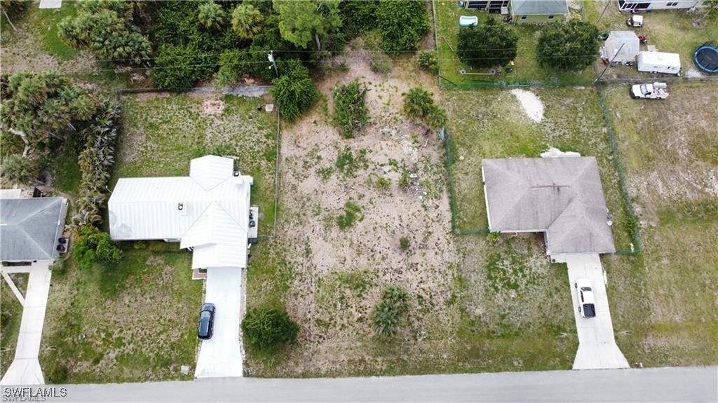 an aerial view of house with yard