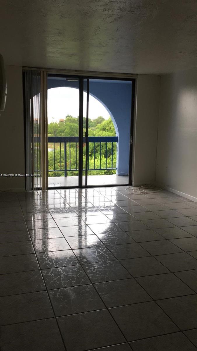 a view of an empty room with a large window