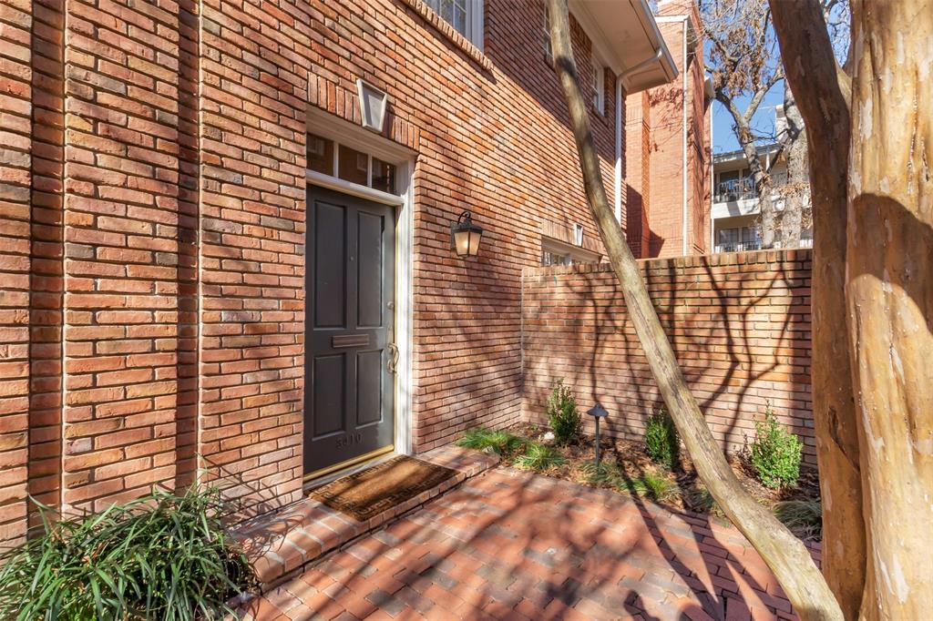 a view of a brick house with a door