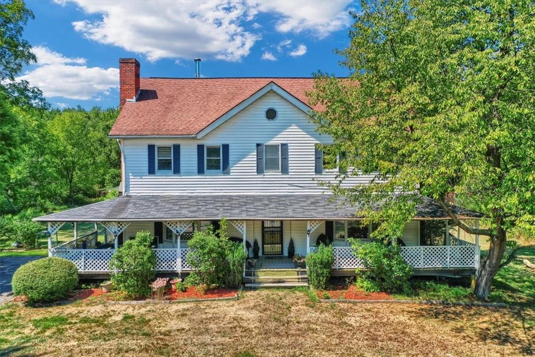 Country-style home with a porch