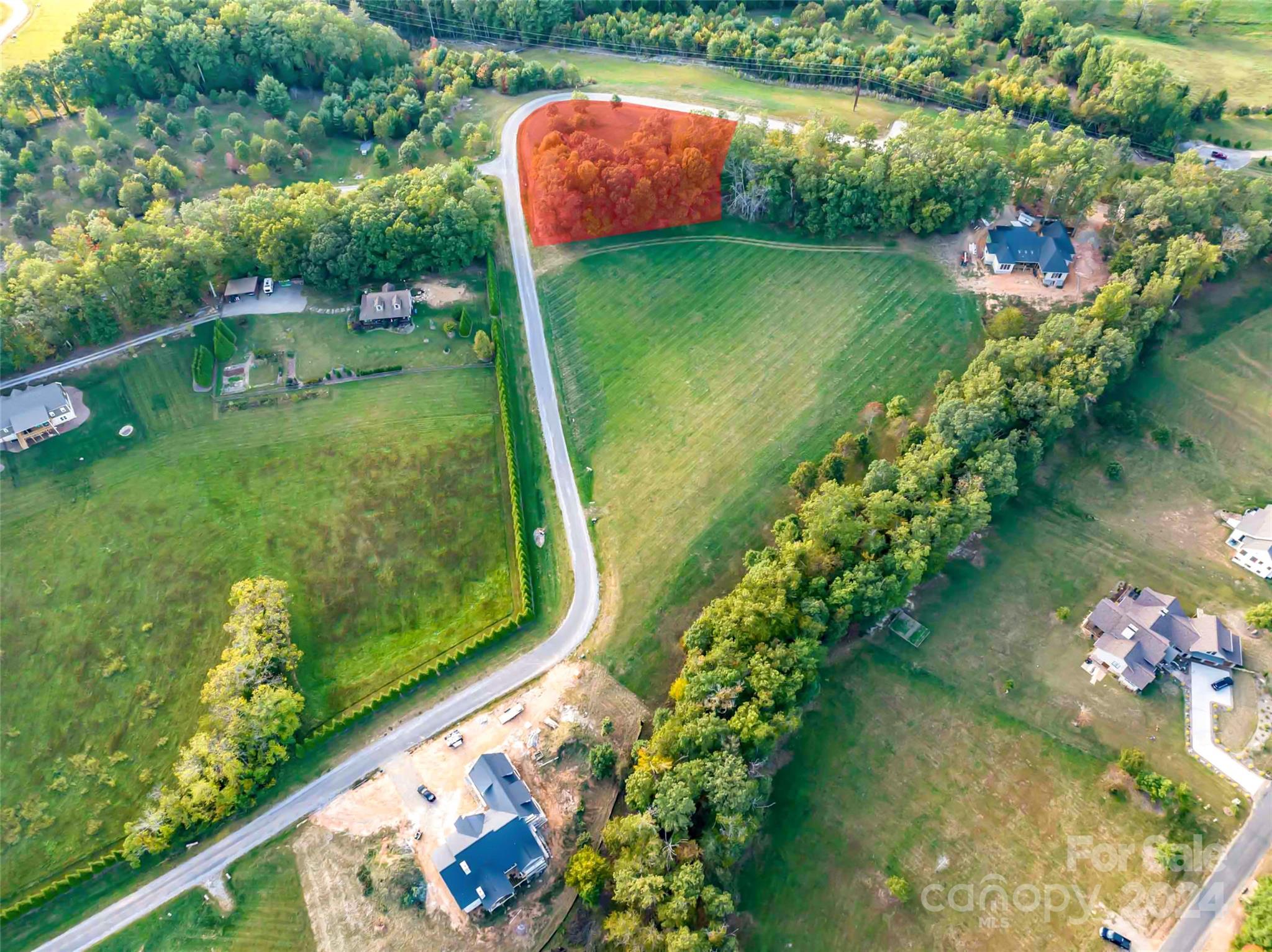 a view of a lake with a yard