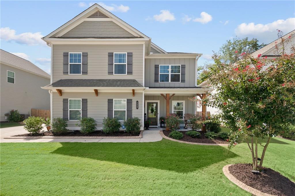 a front view of a house with garden