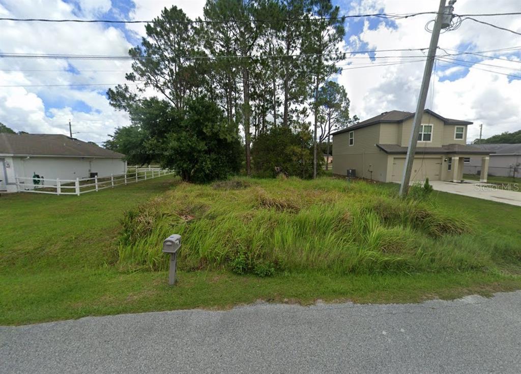 a view of a house with a street