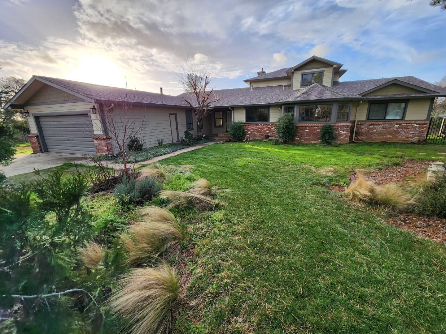 a front view of a house with garden