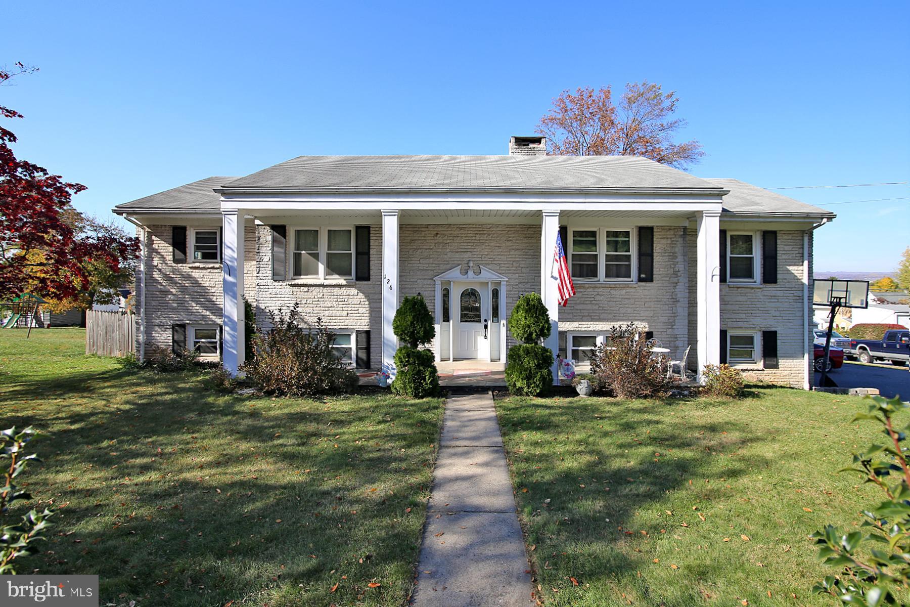 a front view of house with yard