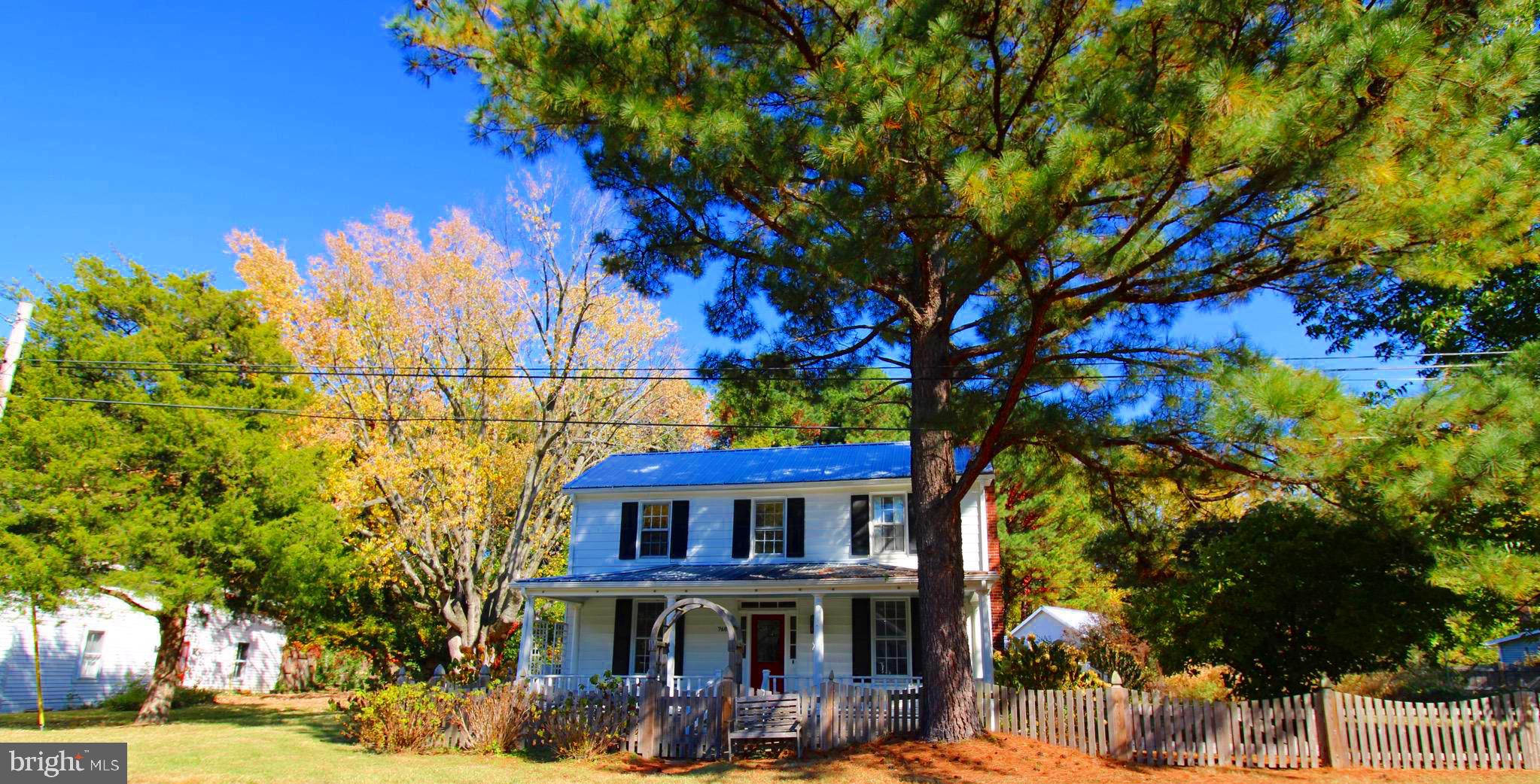 a view of a house with a tree