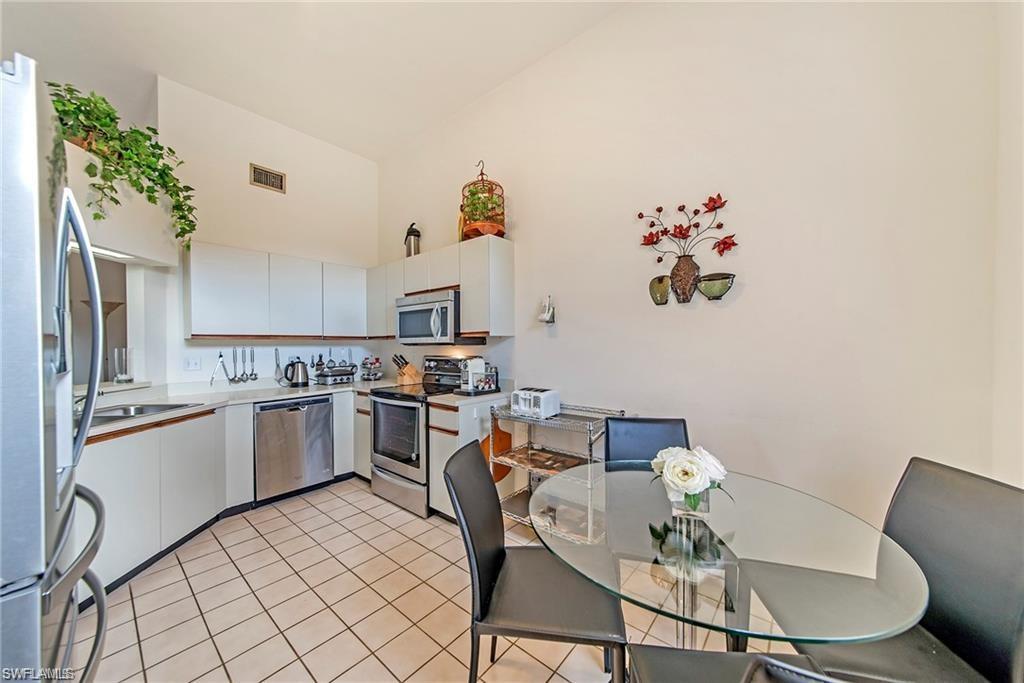 a kitchen with a table and chairs in it