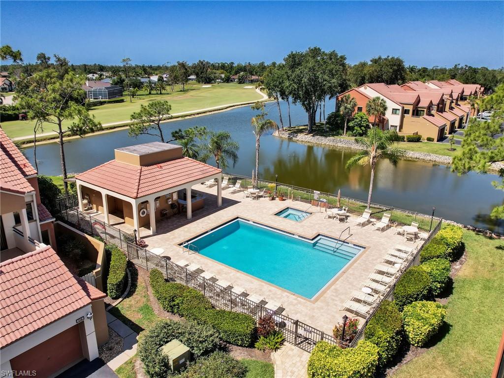 View of pool featuring a water view and a patio area