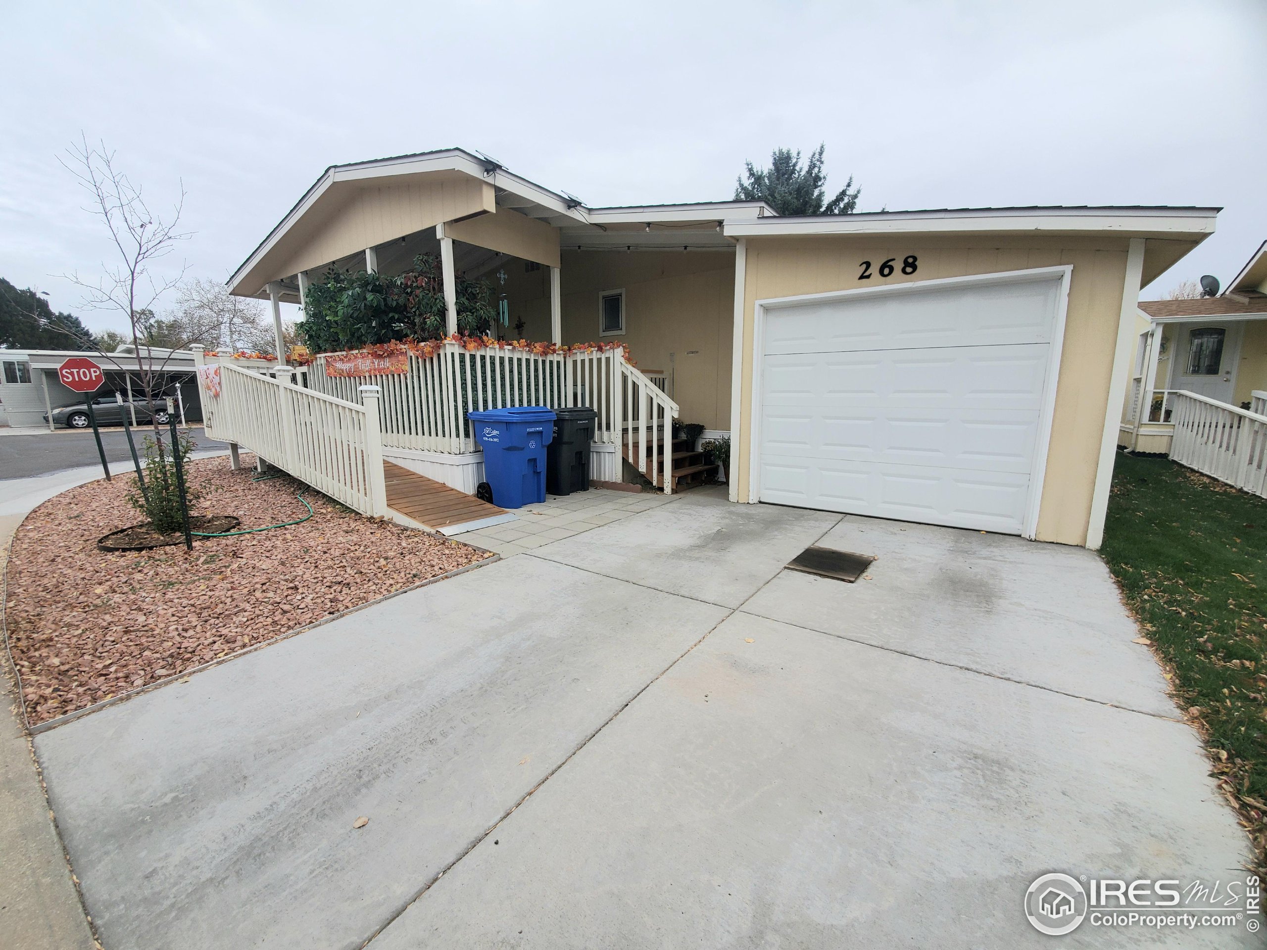 a view of a house with large space and a garage