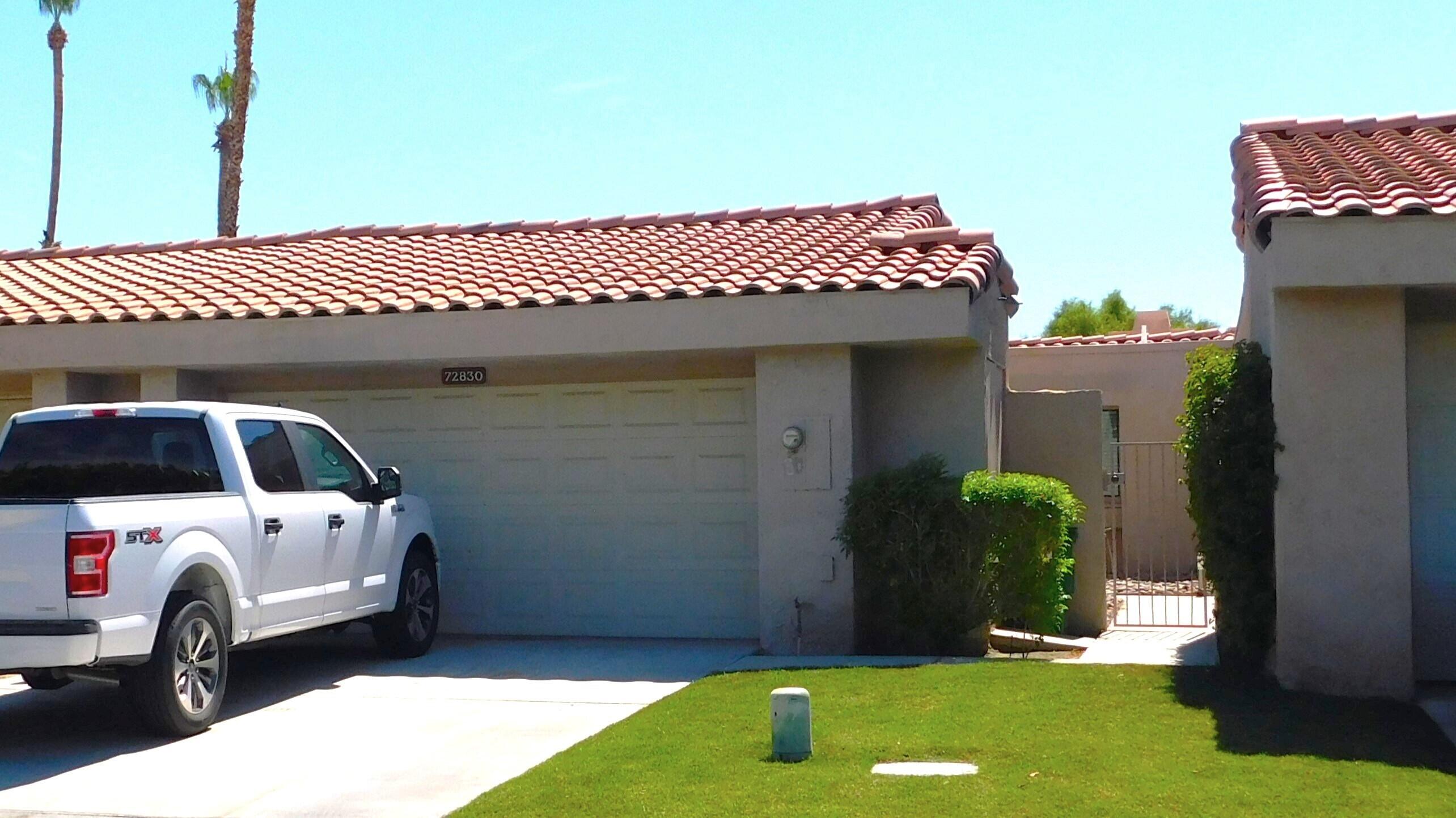 a view of a house with a back yard