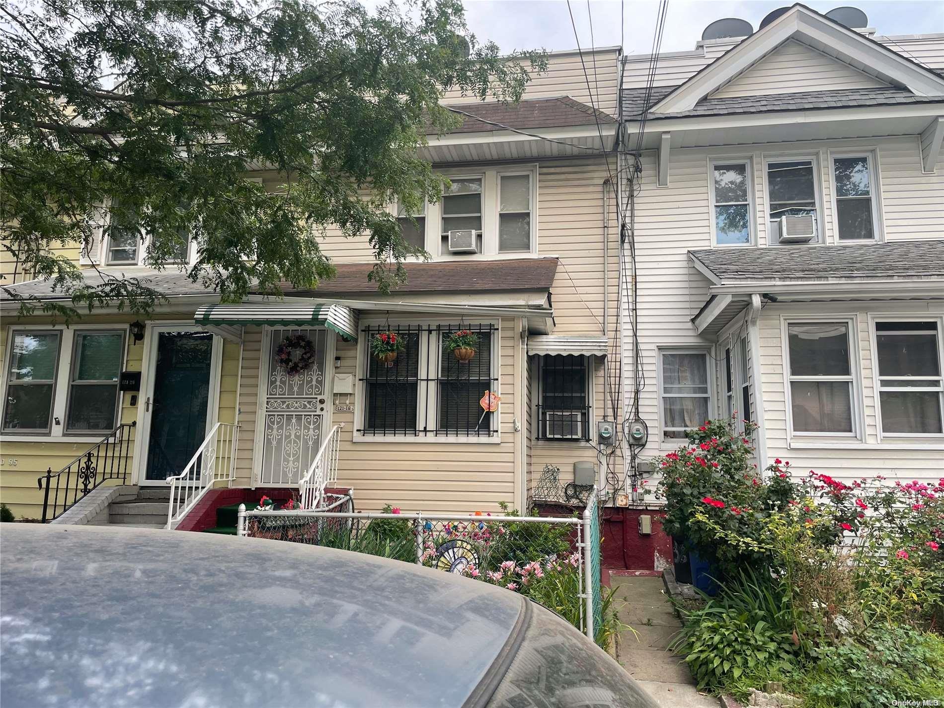 front view of a house with a small yard