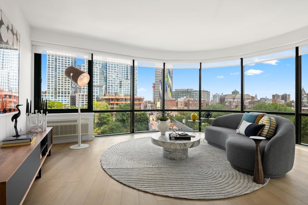 a living room with furniture and a large window