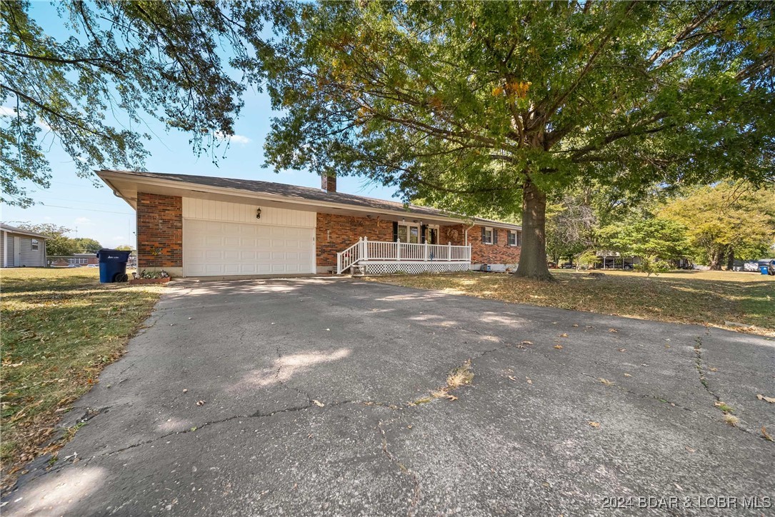 Attached, 2 car garage with asphalt drive.