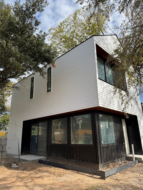 a view of a house with a tree