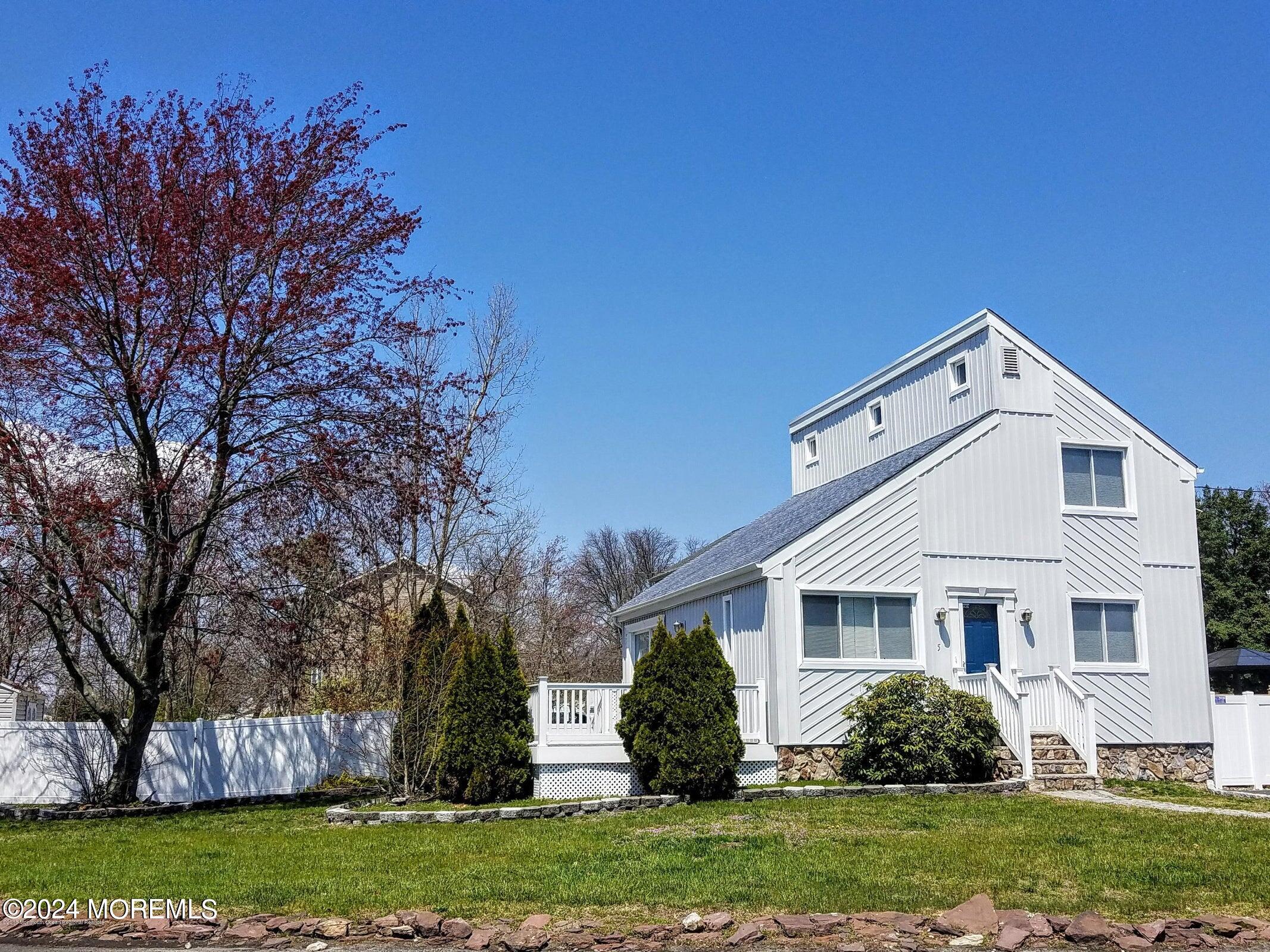 front view of a house with a yard