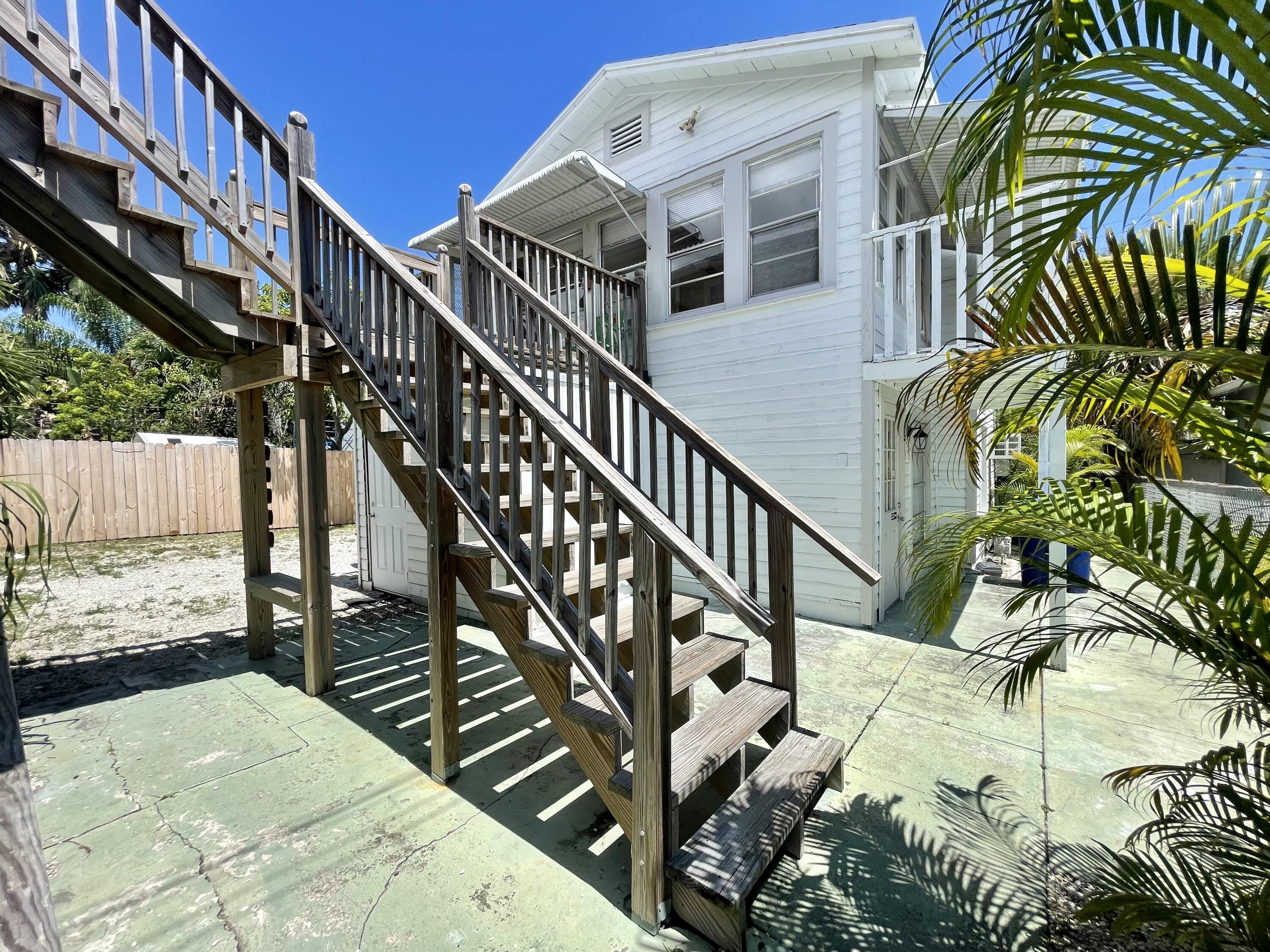 a view of entryway with wooden stairs