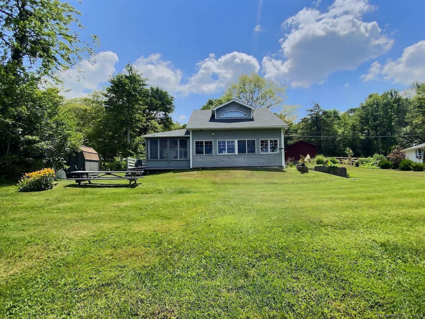 a view of a house with a big yard