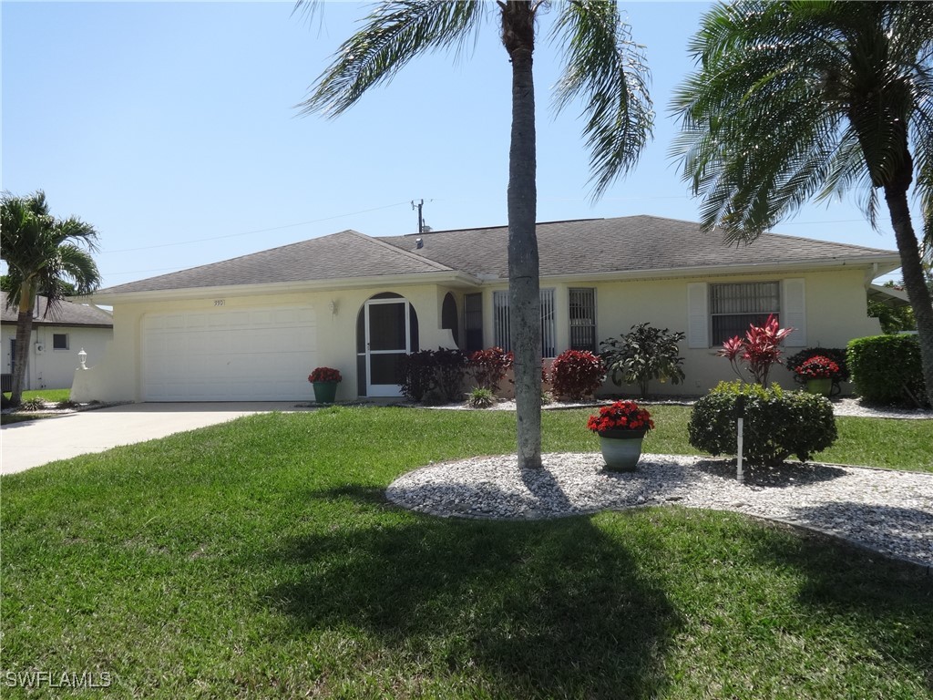 a front view of a house with a garden and plants