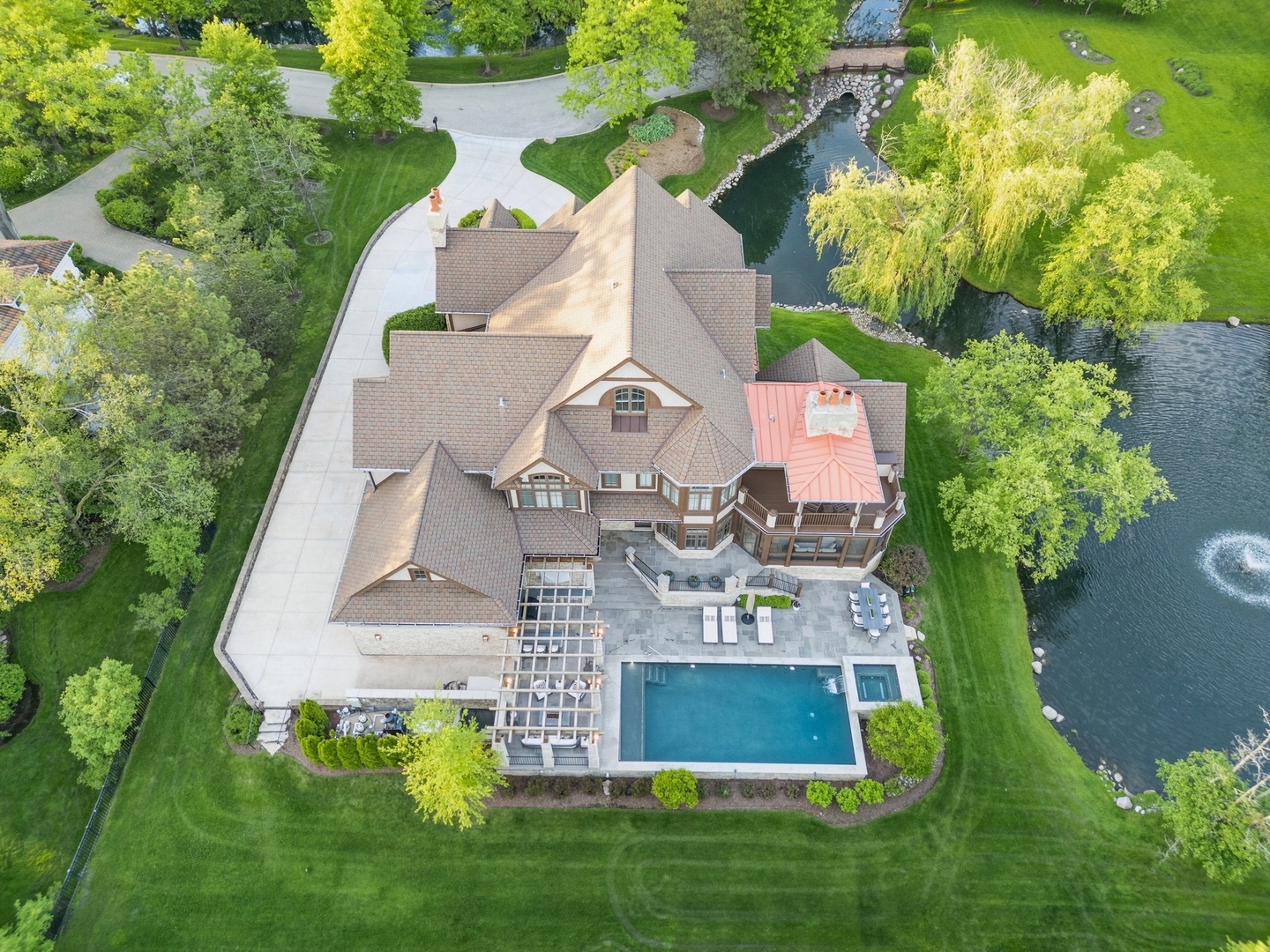 an aerial view of residential house with outdoor space and swimming pool