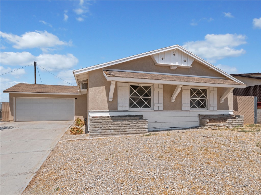 a front view of a house with a road