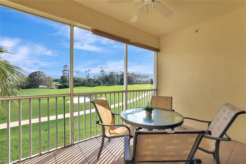 a view of a balcony with a table and chairs