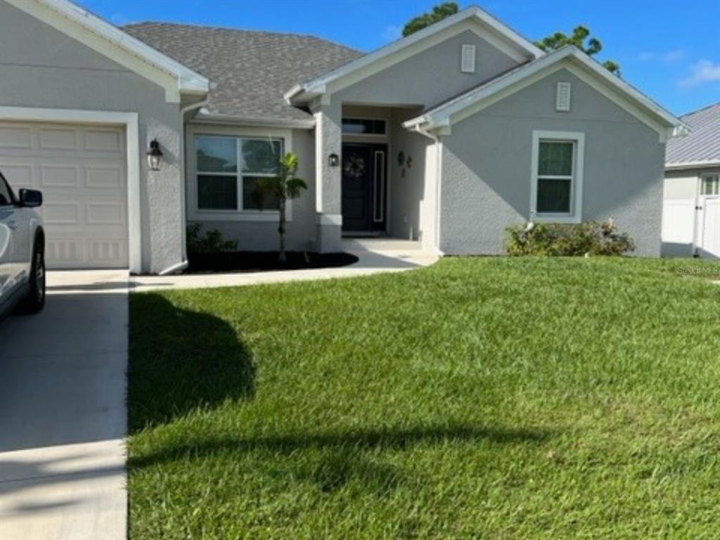 front view of a house with a yard