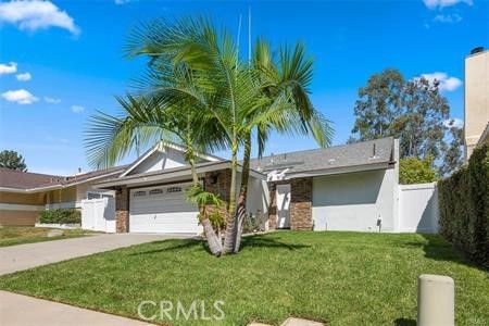 a front view of house with yard and entertaining space