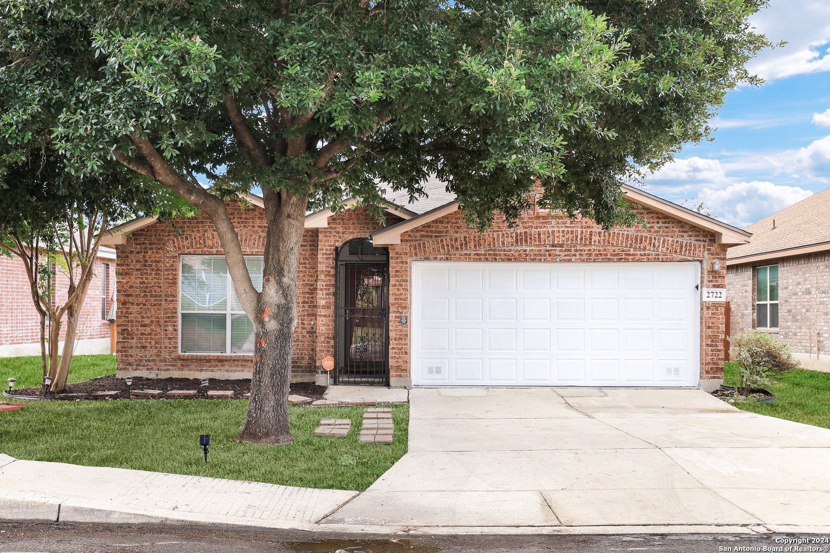 front view of a house with a yard