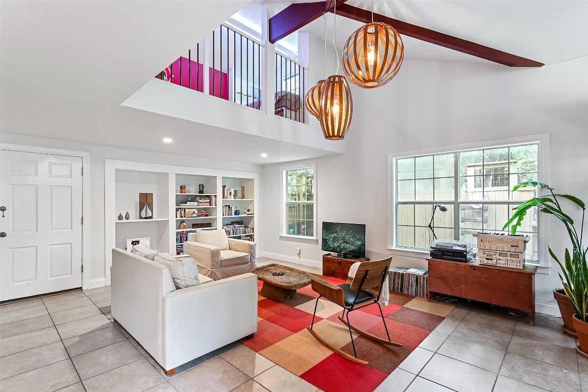 Living room with loft flex space above.