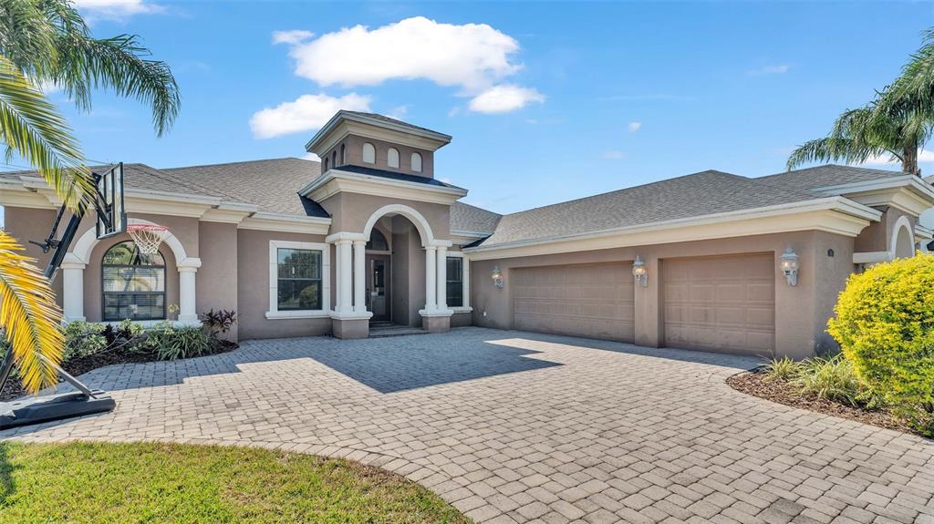 a front view of a house with a yard and garage