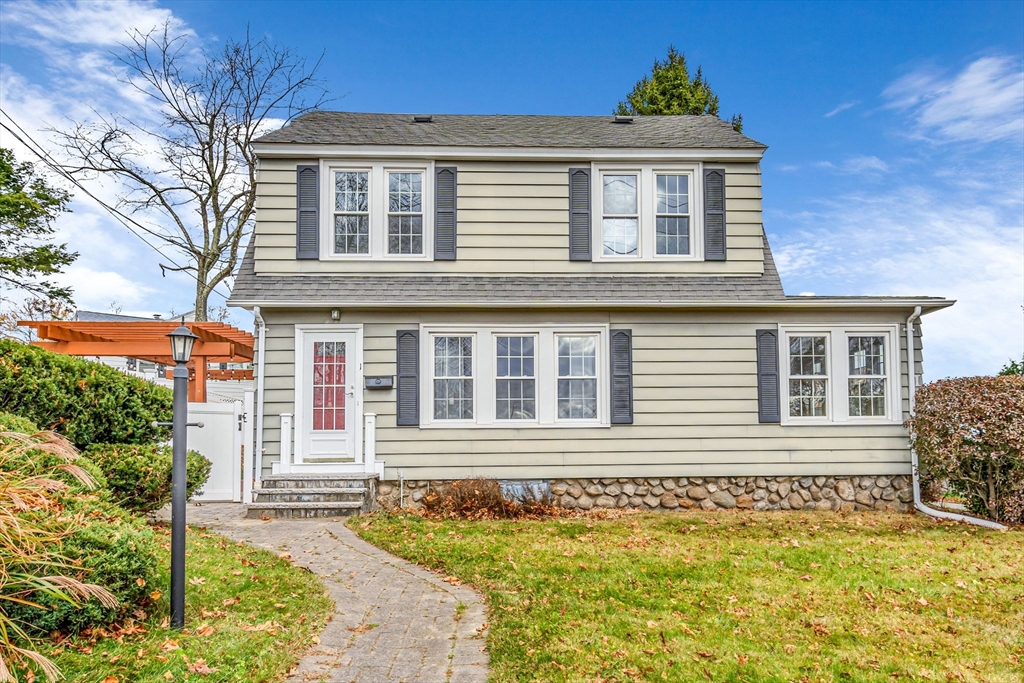 front view of a house with a yard