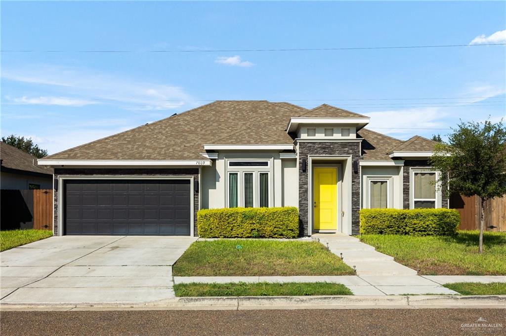 Prairie-style house featuring a garage