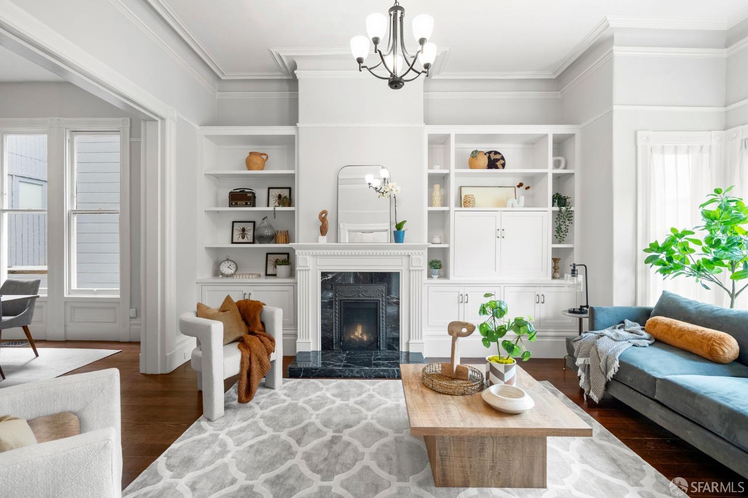 a living room with furniture and a fireplace