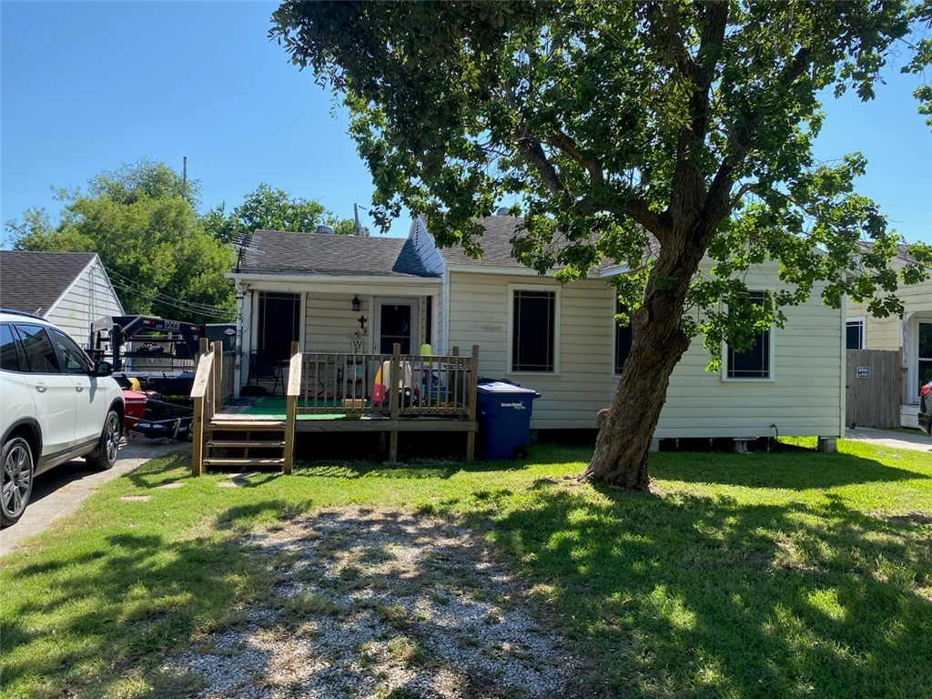 a view of a house with backyard porch and sitting area