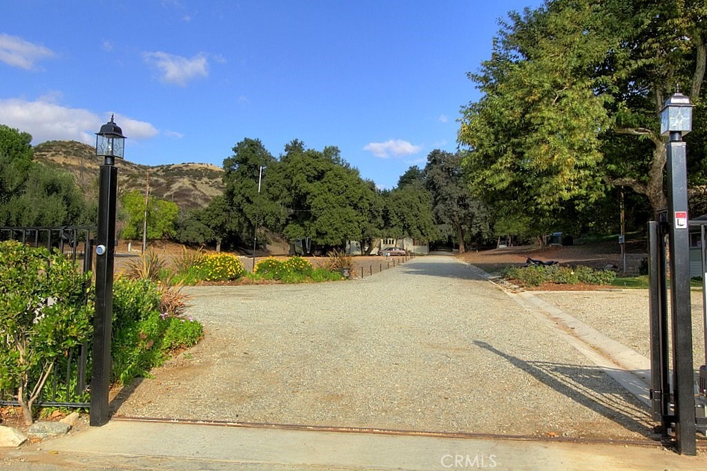 a view of a swimming pool with a yard