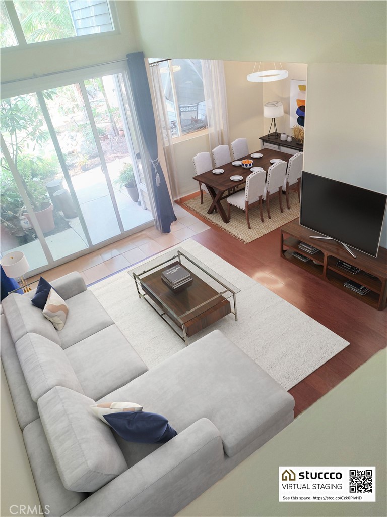 a living room with furniture rug and window