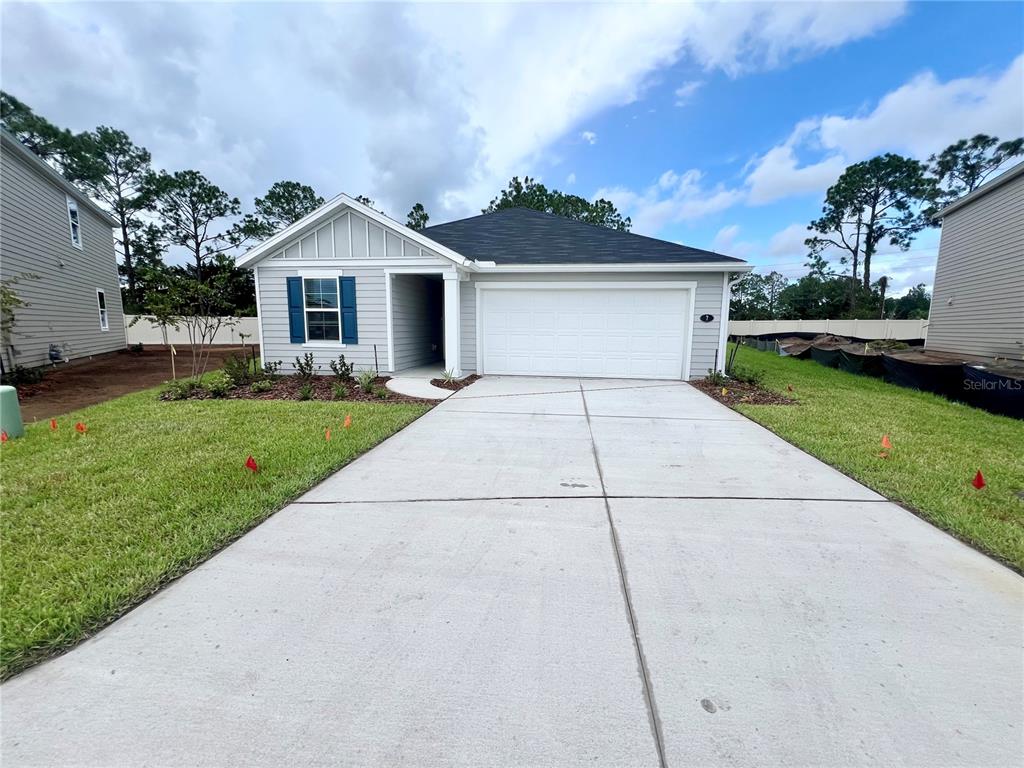 a front view of a house with yard