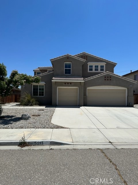 a front view of a house with a garage