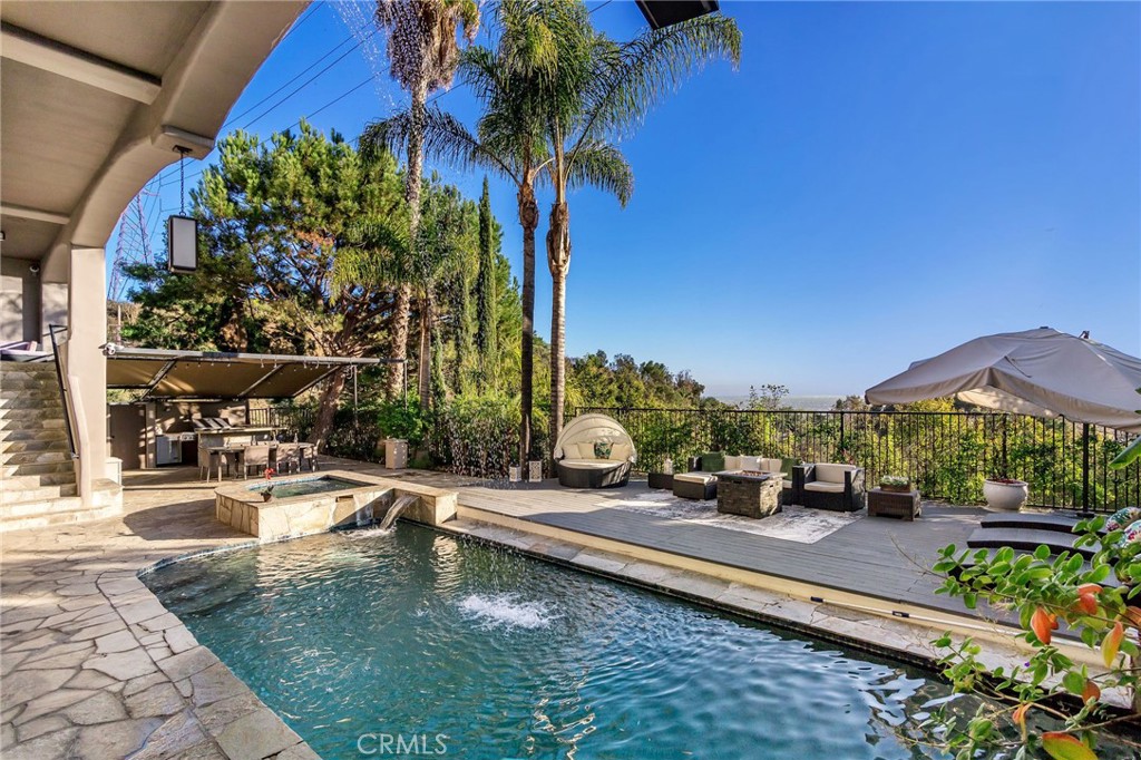 a view of a swimming pool with a patio