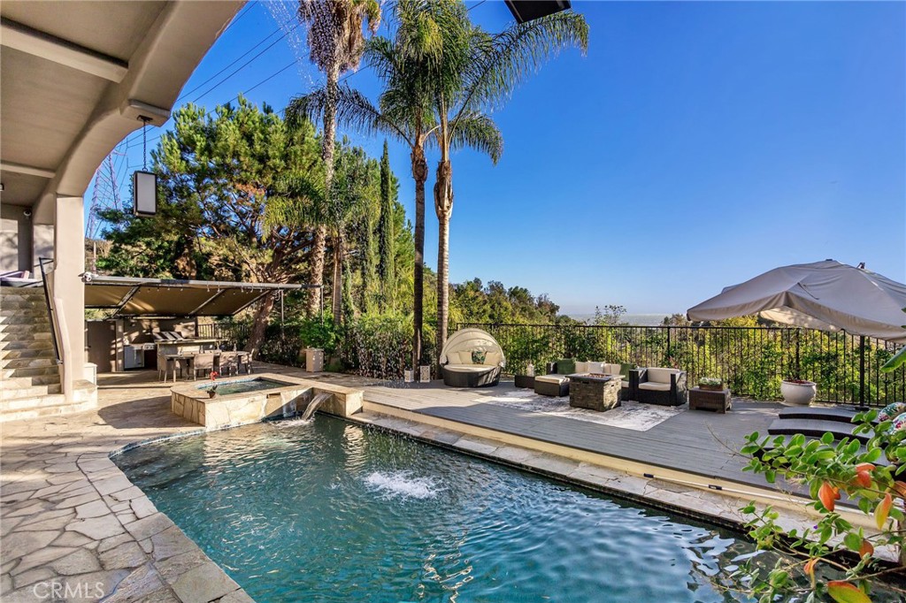 a view of a swimming pool with a patio