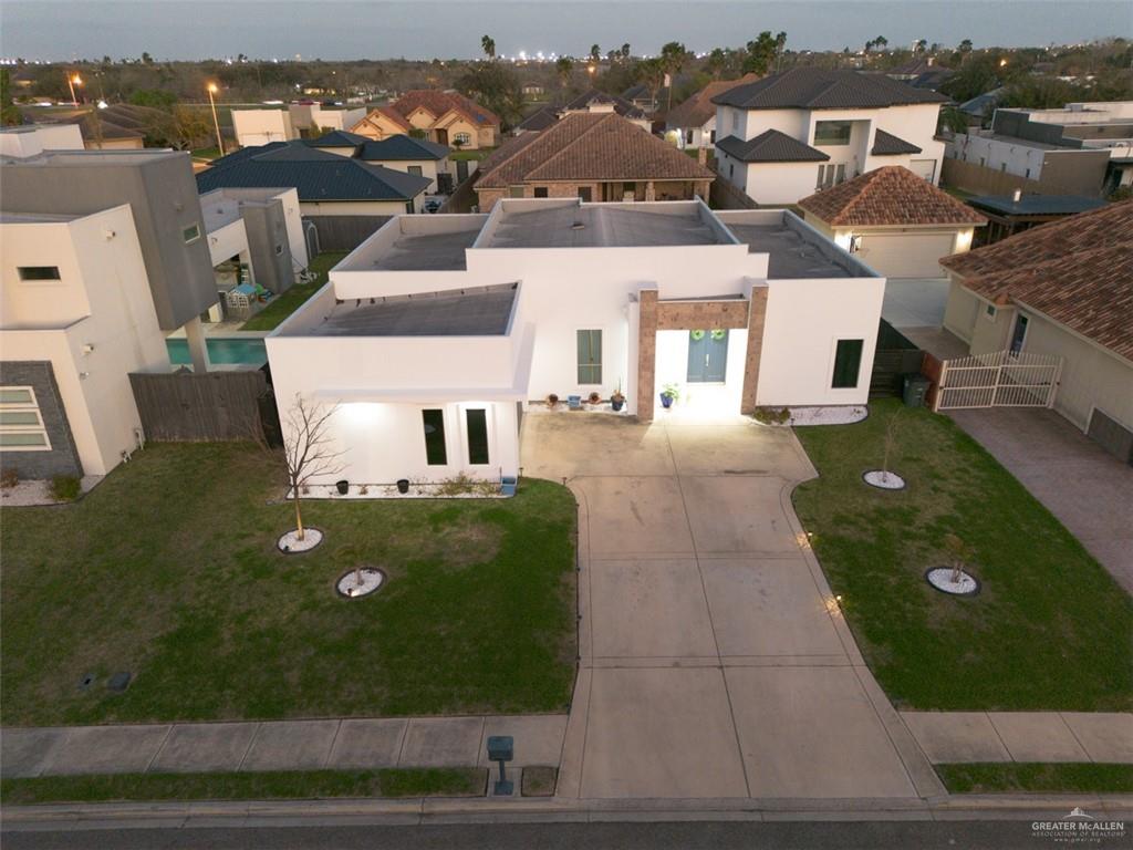 an aerial view of a house with yard