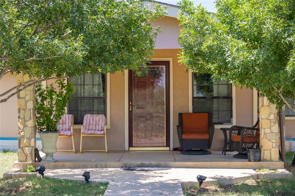 a couple of chairs in front of house