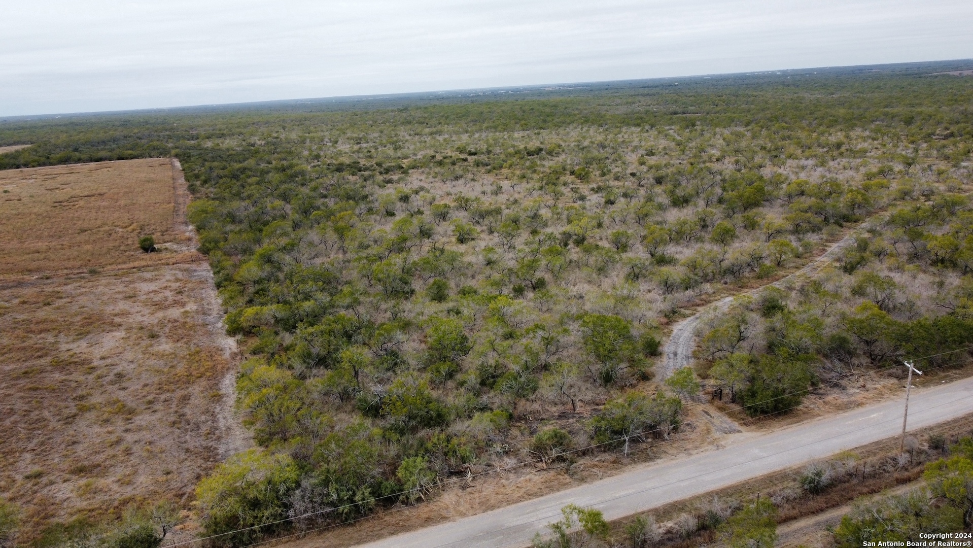 an aerial view of house with yard