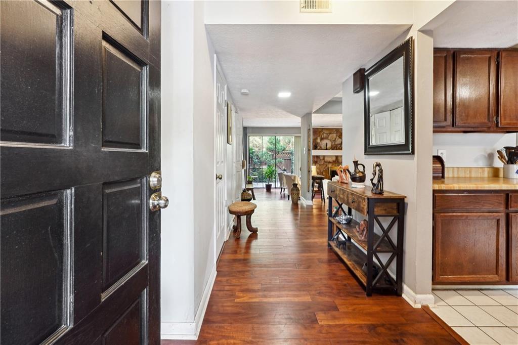 a hallway with seating area and stainless steel appliances