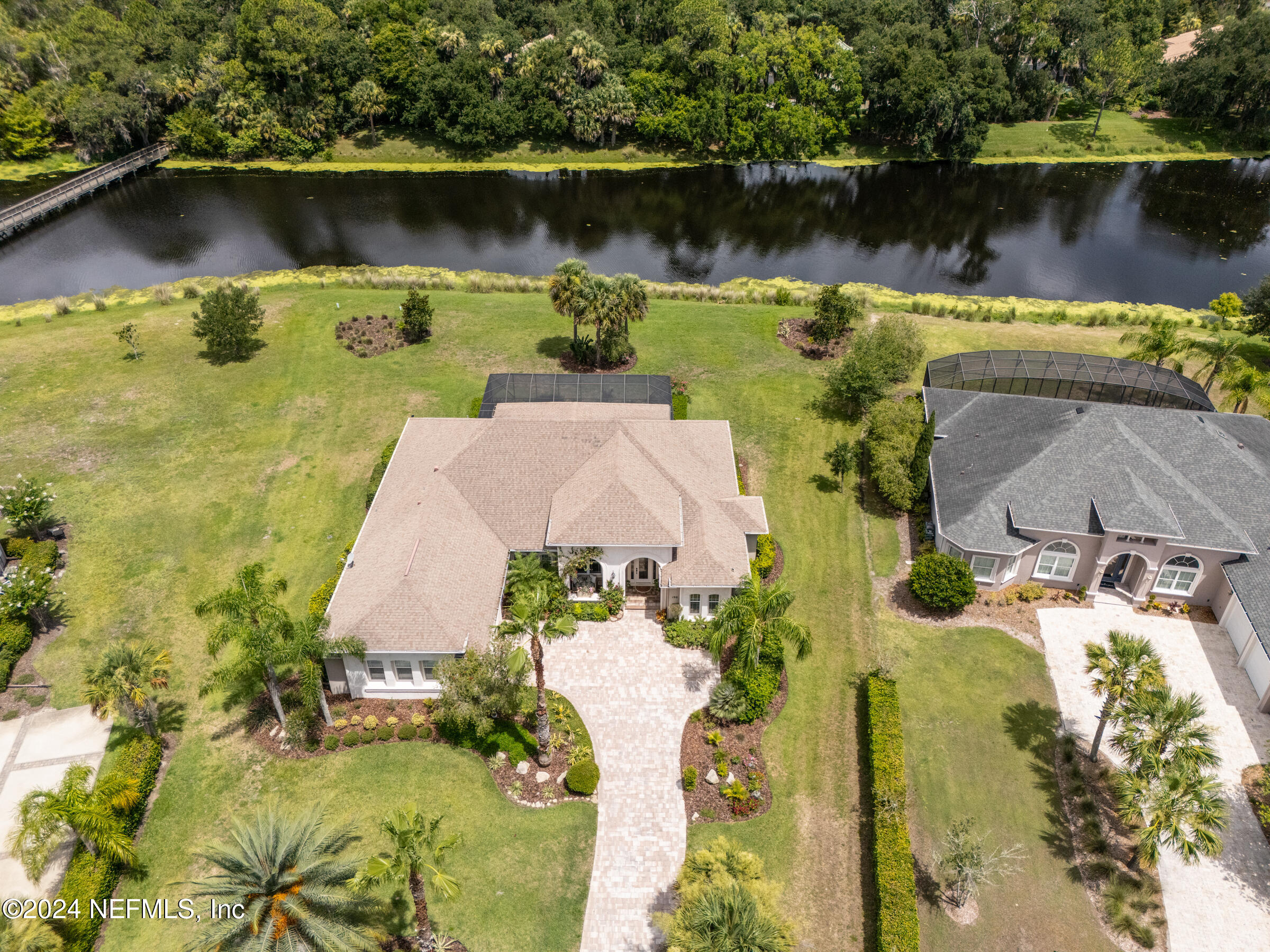 an aerial view of a house with a lake view