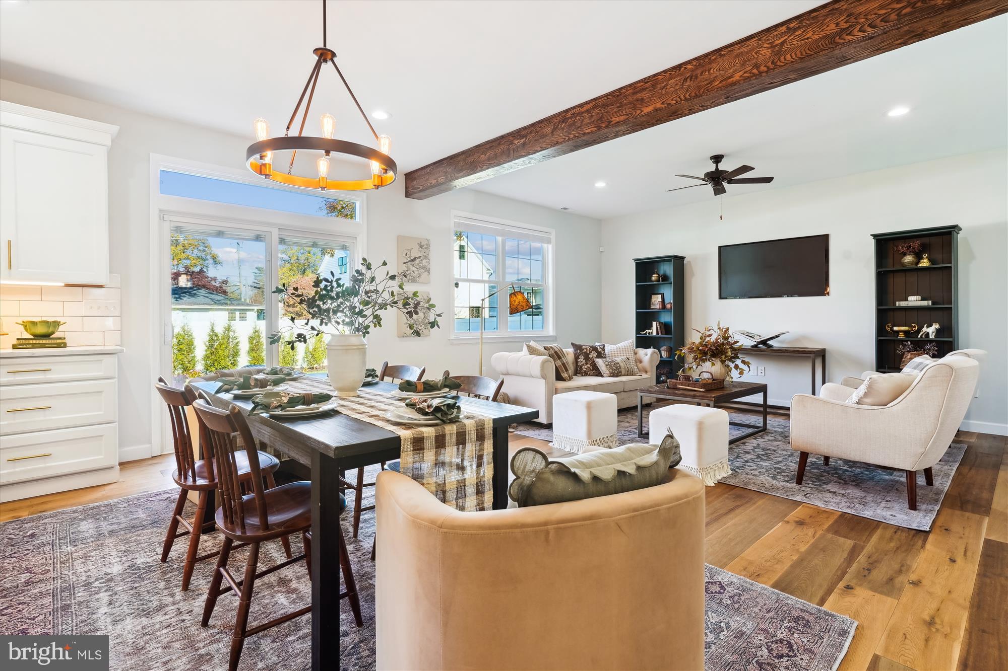 a view of a dining room with furniture window and wooden floor